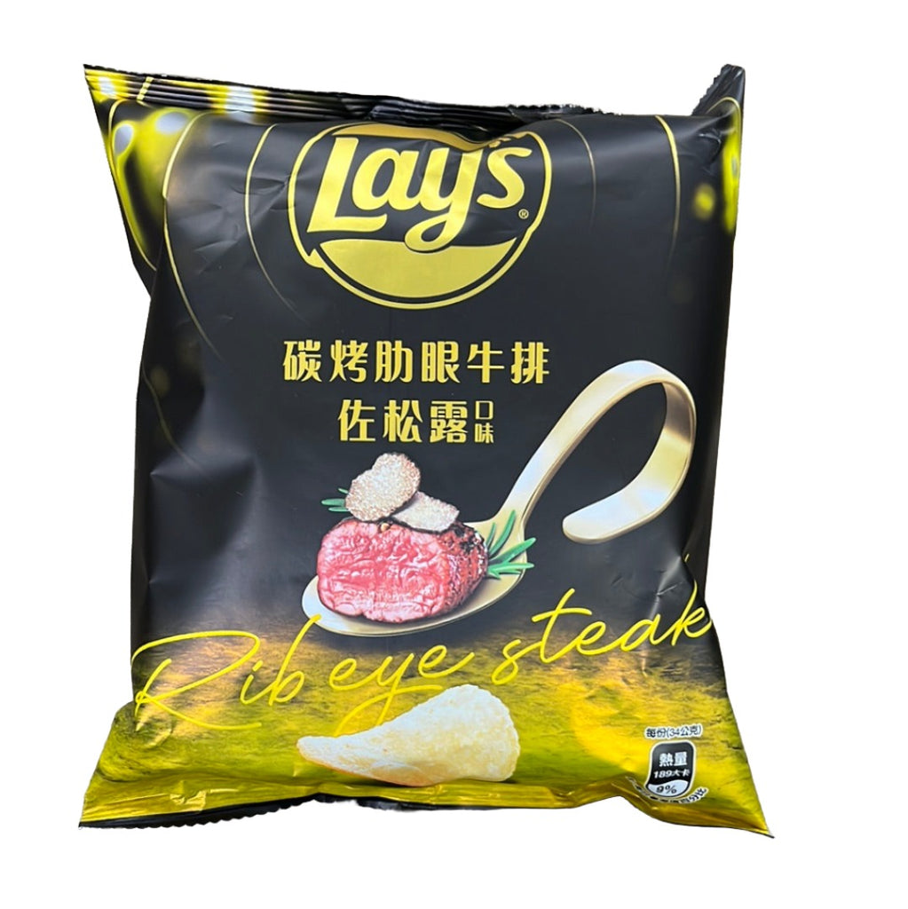 Savor the succulent flavor of LAY'S Rib Eye Steak Potato Chip. These crispy chips are seasoned with the robust taste of rib eye steak, offering a mouthwatering blend of savory spices and hearty beef flavor in every bite. Perfect for those craving a bold and satisfying snack. Treat yourself to a gourmet experience with LAY'S Rib Eye Steak Potato Chip!